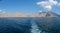 Panorama from the back of a Dhow Boat looking to the Fjords, beautiful blue water, mountains and clouds of Musandam, Oman in the