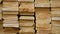 Panorama of background of shelves of wood. Warehouse wooden logs with processing