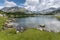 Panorama of Banderishki Chukar and Todorka Peaks and reflection in Muratovo lake, Pirin Mountain