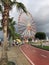 Panorama of Batumi. Carousel, red road, palm trees and amazing sky over the Black Sea.