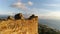 Panorama of the beautiful city Syedra overwashed by Mediterranean sea during the sunset. Flying copter over ruined