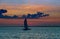 Panorama of beautiful at horizon over sunset sailboat in on the ocean in the evening sunlight