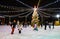 Panorama of a beautiful ice rink decorated with a Christmas tree and illumination with