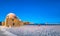 Panorama of the beautiful old harbor of Chania with the amazing lighthouse, mosque, venetian shipyards, at sunset, Crete.