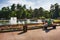Panorama at the beautiful Sokolniki park in Moscow, people relax near the big fountain in nice sunny day