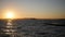 Panorama of beautiful sunset by the sea. Military ships at sea at sunset