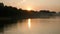 Panorama of beautiful sunset by the sea. The reflection of the sunset in the water