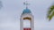 Panorama Bell tower of a small church above trees