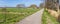 Panorama of a bicycle path and an old farm in Gaasterland