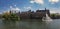 Panorama Binnenhof, Hofvijver, the fountain and the island overgrown with plants.