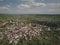 Panorama from a bird`s eye view. Central Europe: The Polish town of Kolaczyce is located among the green hills. Temperate climate.