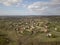 Panorama from a bird`s eye view. Central Europe: The Polish village is located among the green hills and river. Temperate climate