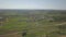 Panorama from a bird`s eye view. Central Europe: town or village is located among the green hills. Temperate climate. Flight dron