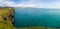 Panorama at birds market grassland rock cliffs at Iceland ocean coast. Arnastapi