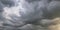 Panorama of black sky background with storm clouds. thunder front