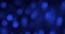 Panorama of blue defocused round bokeh. Festive background. Christmas lights in the form of a blurred circle