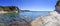 Panorama of blue sea and the rocky reef