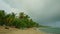 panorama from blue sea with strong white waves to golden sandy beach