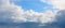 Panorama of the blue sky with cumulus dense clouds