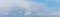 Panorama of blue sky with ribbed white clouds