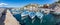 Panorama of Boats in a pier around Kamini beach in Hydra Island