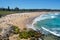 Panorama of Bondi beach on a hot sunny summer day with blue sky in Sydney Australia