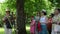 Panorama of botanical garden guide tell stories to tourist group