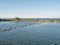 Panorama of breakwaters and birds on artificial island De Kreupel in lake IJsselmeer, Netherlands