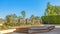 Panorama Brick patio with a raised platform in front of the arched white gate