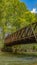 Panorama Bridge with metal guardrails over the glistening water at Ogden River Parkway