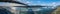 Panorama of a bridge over Jokulsarlon glacier and icebergs floating in the river