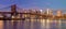 Panorama of Brooklyn Bridge and Manhattan skyscrapers at sunrise