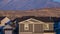 Panorama Brown urban house with mountain backdrop day light