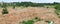 Panorama of a building landfill in a forest glade.