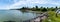 Panorama of camper vans parked in a parking lot on the idyllic coast of Funen Island in southern Denmark