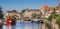 Panorama of a canal with old ships and historical houses in Zwolle