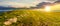 Panorama of carpathian alpine meadows at sunset