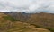 Panorama of Caucasian mountains near Gergeti Trinity Church, village of Gergeti and Stepancminda in Georgia.