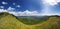 Panorama of the Caucasus mountains. The greater Caucasus mountain range, grass, blue sky, pine