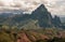 Panorama of central Laos with the highest mountains and a dramatic sky in the background