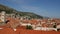 Panorama of the city of Dubrovnik, from the walls of the old city. Camera wiring on tiled roofs.