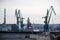 Panorama of the city of Gdansk. Port cranes on the background of city panorama.