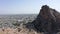 The panorama of the city of Osh opening from behind the mountains. Sulaiman-Too is a rocky sacred mountain and a symbol of the cit