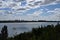 Panorama of the city. View of the reservoir. Overgrown banks.