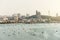 Panorama of Cityscape with construction buildings and Seascape with boats, bright sky and cloud of Pattaya beach in Chon Buri.