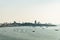 Panorama of Cityscape with construction buildings and Seascape with boats, bright sky of Pattaya beach in Chon Buri, Thailand