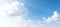 Panorama of clear blue sky with white cloud background. Clearing