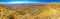 Panorama of cliffs, landscape, and hairpinned road, Makhtesh crater Ramon