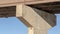 Panorama Close up of the abutment supporting the span of a beam bridge on a sunny day