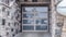 Panorama Close up of glass panel garage door of home with stonw brick exterior wall